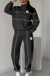 Casual tracksuit detail, black sweatshirt and pants set with white piping and letter M print.