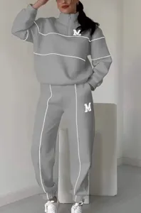 Stylish casual half-zip sweatshirt and sweatpants tracksuit set for women autumn winter.