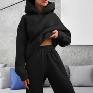 Solid black hooded sweatshirt and trousers tracksuit set for women, cozy casual daily wear.