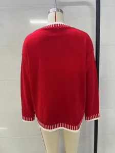 Women's casual long sleeve red knitted sweater with white contrast ribbed hem and cuffs.