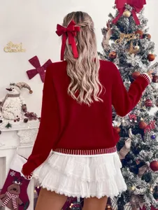 Women's red long-sleeve knit sweater with white ruffle skirt for a cozy holiday fashion look.