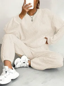 Stylish women's ribbed knit two-piece loungewear set featuring long sleeve top and cozy pants.