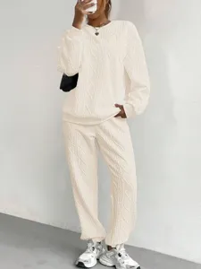 Cozy autumn winter knit sweater and pants two-piece set, casual chic ribbed texture lounge outfit.