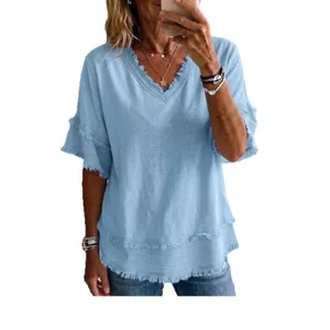 Light blue V-neck short sleeve casual women blouse with frayed raw hem and relaxed fit.