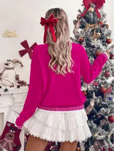 Women's bright pink long sleeve knit sweater and white tiered ruffled skirt Christmas outfit.