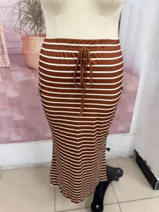 Close-up of the striped knit bodycon skirt featuring an adjustable drawstring waist and side pockets.