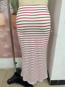 Detail shot of the red and white striped knit slim hip-hugging skirt on a display form.