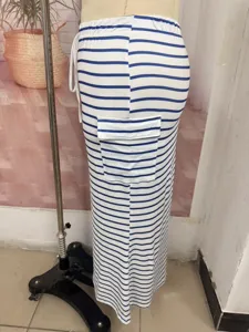 Close-up detail view of summer striped knit slim bodycon long skirt with side pocket.