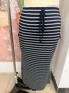 Striped knit bodycon long skirt, casual summer wear, elastic drawstring waist detail.