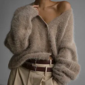 Detail shot of soft fuzzy faux-mink cardigan, cozy loose V-neck knitwear texture and double belt styling.