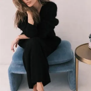 Cozy black faux mink cardigan detail, soft knitwear texture, relaxed fit winter apparel.