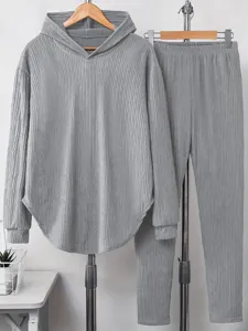Detail shot of the solid grey hooded sweatshirt and long pants loungewear set on a display rack.