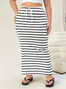 Detail view of plus size striped knit maxi skirt with drawstring and side utility pockets.