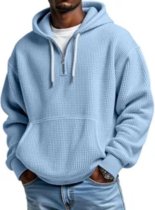 Men's light blue waffle knit quarter-zip hoodie with hood detail close up product view.