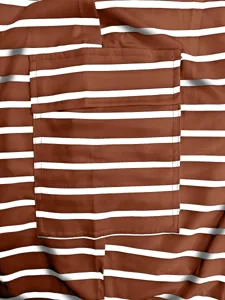 Detailed view of the brown and white striped knit fabric with a matching chest pocket.