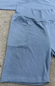 Casual solid color ribbed shorts detail featuring a convenient side pocket and elastic high waist.