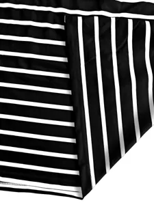 Detail view of the classic black and white striped knit fabric for stylish women's skirts.