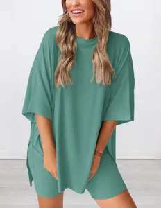Detail shot showing the loose casual short-sleeve top and shorts two-piece set in sage green.
