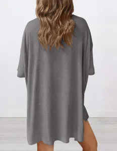 Back view detail of women's loose solid color short sleeve casual top in dark grey.