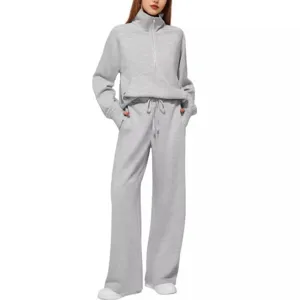 Women's half-zip sweatshirt and wide-leg sweatpants two-piece casual athleisure set.