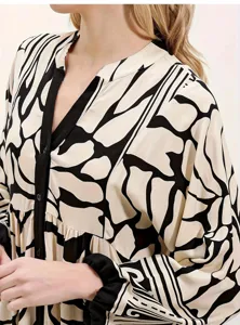 Elegant black and white print long sleeve dress with V neck and buttons for women. Comfortable.