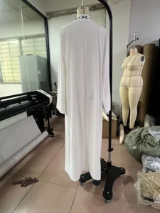 White long robe dress featuring stylish embroidery long sleeve coat and matching headscarf set.