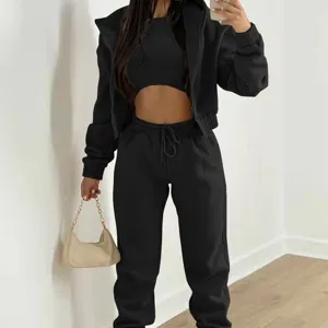 Detail view of the stylish black 3-piece casual tracksuit featuring hoodie, crop top, and pants.