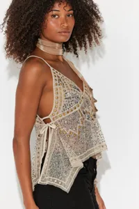 Detailed view of sheer mesh sequin studded halter cami top featuring stylish side ties.