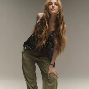 Close-up detail of the stylish sequin embellished camisole and cargo pants outfit.