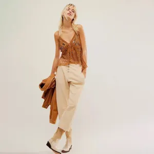 Sparkly beaded camisole top with sheer sequin design for stylish summer beach wear.