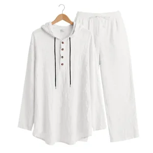 Men's white linen hooded henley shirt and loose trousers casual two-piece suit detail.