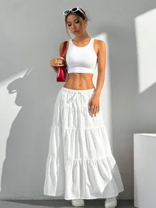 Detailed view of the casual white tiered maxi skirt showcasing delicate drawstring and fabric texture.