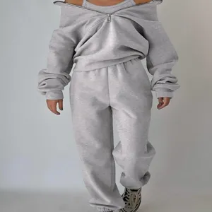 Grey fleece tracksuit for women featuring a zip-up off-shoulder sweatshirt and sweatpants.