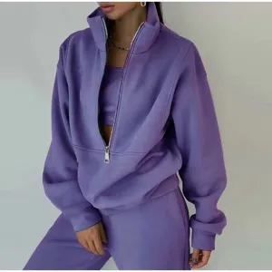 Stylish women's purple fleece half-zip sweatshirt and sweatpants two-piece set casual wear.