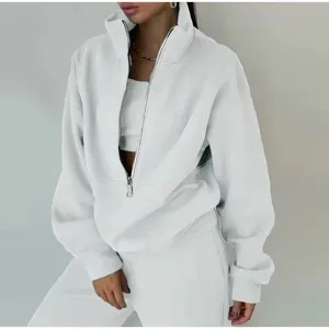 White fleece zip-up sweatshirt and sweatpants two-piece set, casual street style sportswear for women.