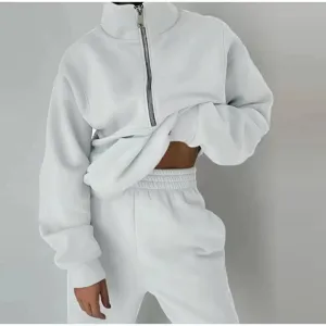 Close-up detail of the casual half-zip fleece sweatshirt and matching sweatpants set.