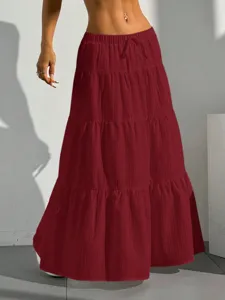 Casual burgundy tiered maxi skirt for women featuring a comfortable drawstring elastic waist.