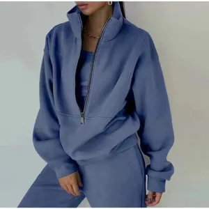 Detailed view of the cozy blue fleece zip-up tracksuit top, soft fabric and collar design.