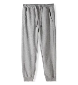 Grey casual sweatpants with drawstring waist, comfortable fit and ribbed ankle cuffs.