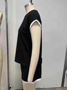 Side detail view of women black white trim contrast casual short sleeve loungewear pajama set.