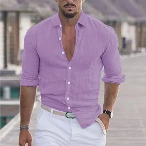 Close up detail of mens purple linen long sleeve shirt outdoor street style scene photo.
