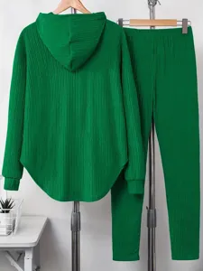 Green two piece lounge set for women, long sleeve hooded sweatshirt and matching pants.