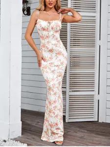 Detailed view of the elegant white floral cami long dress, fitted silhouette and cute drawstring bust.