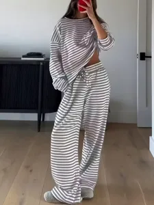 Women striped long sleeve top and high waist pants casual loungewear set for autumn.