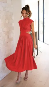 Detail shot of a stylish red sleeveless mock neck midi dress with chic waist cutouts.