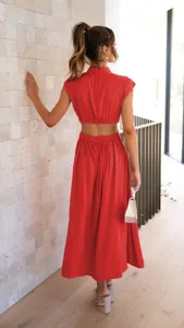 Detailed back view of a stylish red high-neck cut-out long dress, ideal for summer street style.