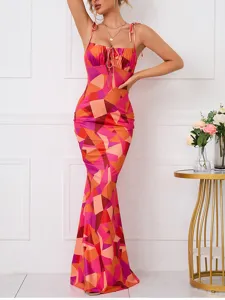Close-up detail showing the vibrant geometric print and adjustable strap of the maxi dress.