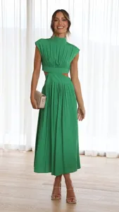 Detail view of the elegant green waist cut-out midi dress showing fine fabric and modern fit.