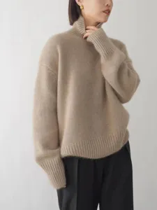 Détail de pull en tricot à col haut décontracté, style ample confortable pour femmes.