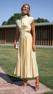 Detailed view of the yellow high collar cutout long dress, showcasing the waist design and fabric texture.